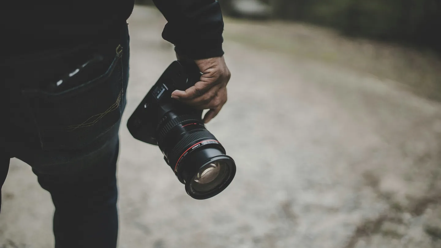 Photographer holding a DSLR camera